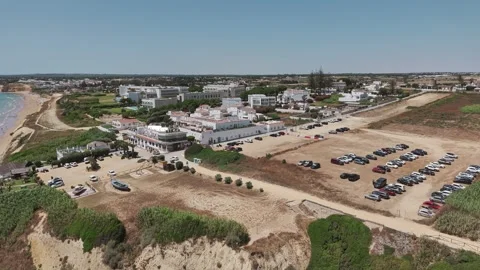 Aerial view of Conil de la Frontera with buildings and parking area near the Vídeos de archivo 343061112