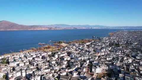 Aerial view of connected Bai residence lakeside ancient town in Dali Yunnan Video stock 337922411