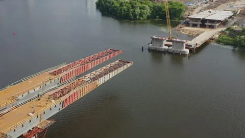 Aerial view of the construction of the bridge and the highway passing through Video stock 108642262