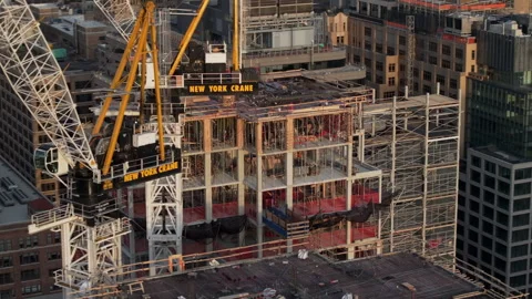Aerial view of a construction crane above New York City Stock Footage 307168320