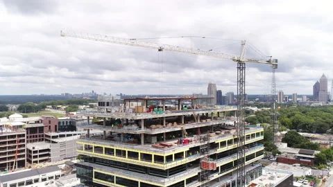 Aerial View of Construction Crane on Building with Workers and Scaffolding Stock Footage 138962385
