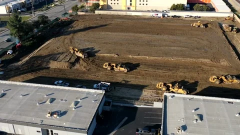 Aerial view of construction equipment and heavy machinery moving earth Stock Footage 150776176