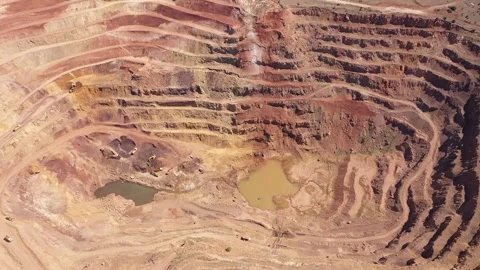 Aerial view of construction equipment working in iron mine Stock Footage 293989087