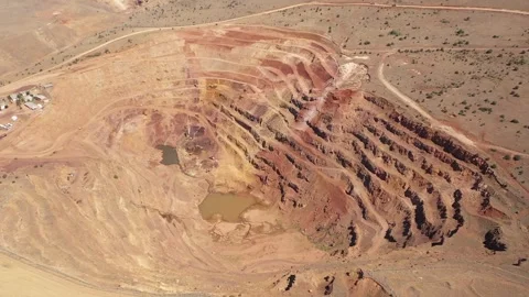 Aerial view of construction equipment working in iron mine Stock Footage 293989150