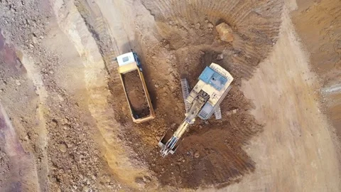 Aerial view of construction equipment working in iron mine Stock Footage 293991122