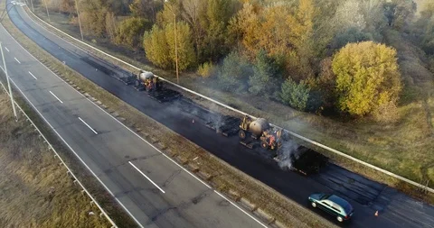 Aerial view: Construction of Highways. Hot Recycling Machines running on the Stockbeeldmateriaal 103306812
