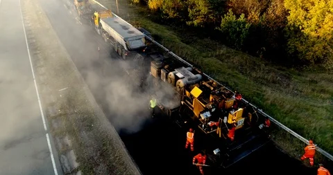 Aerial view: Construction of Highways. Hot Recycling Machines running on the Stock Footage 103308146