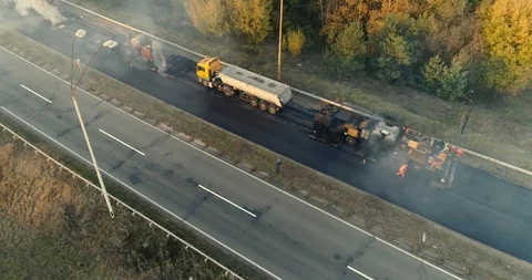 Aerial view: Construction of Highways. Hot Recycling Machines running on the Stock-Footage 103308935