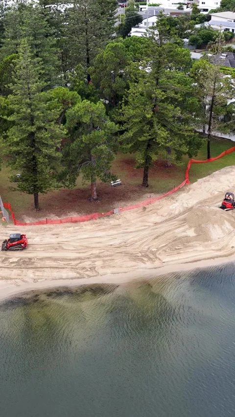 Aerial View of Construction Machinery Renovating a Canal Beach in Gold Coast Stock Footage 334282575
