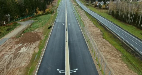 Aerial view of the construction of a new high-speed road in the forest. CCAD Stock Footage 119032475