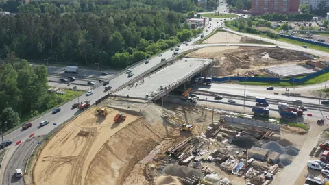 Aerial view of the construction of a road junction on a busy highway Stock Footage 108727442