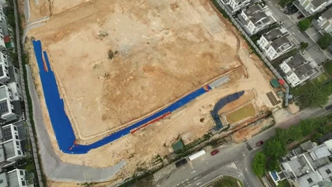 Aerial View of Construction Site with Blue Tarps and Dirt Ground Stock Footage 311575472