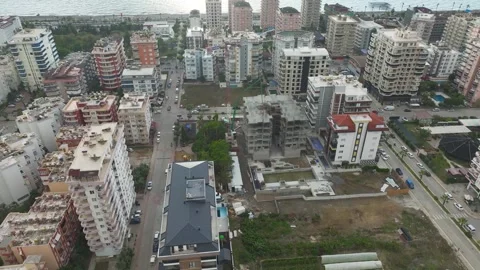 Aerial View: The construction site comes alive with heavy machinery and concrete Stock Footage 296074583