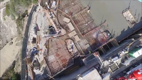 Aerial view of construction site with crane and concrete pouring Stock Footage