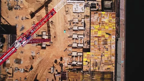 Aerial view of a construction site with crane and foundation work, urban Stock Footage 279655174