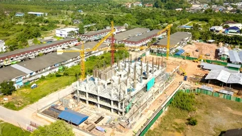 Aerial view of a construction site with cranes and steel frames Stock Footage 312434448