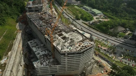 Aerial View of Construction Site with Cranes and Modern Buildings Under Stock Footage 316450366