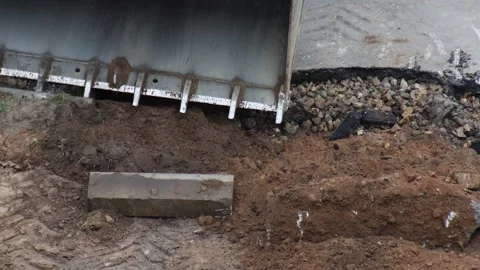 Aerial view construction site excavation earthmover bucket digging trench for Stock Footage 344863973