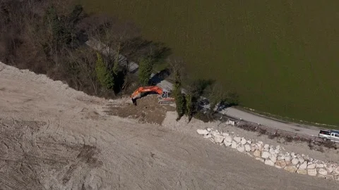 Aerial view of construction site with excavator and road reinforcement Stock Footage 332480443