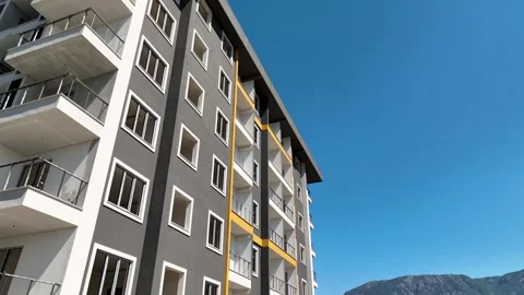 Aerial View: A construction site featuring a residential building with Stock Footage 296026433