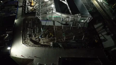 Aerial View of Construction Site with Framework and Machinery at Night Stock Footage 312143026