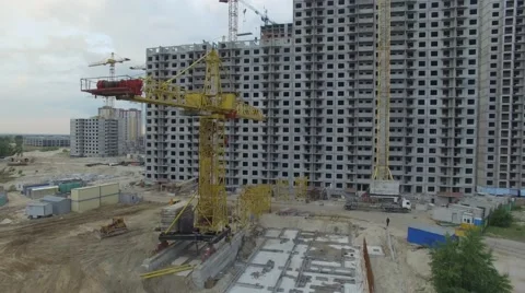 Aerial view. Construction site with many cranes at a big city. Sunset time Stock Footage 63742660