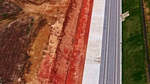 Aerial view of a construction site next to a railroad track in progress Stock Footage 341741944