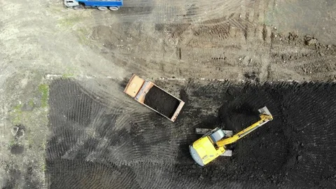 Aerial view of the construction site. Special machinery digs a pit. Stock Footage 111530128