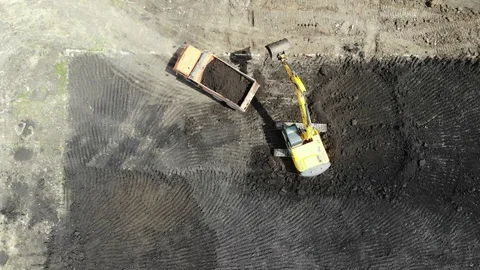 Aerial view of the construction site. Special machinery digs a pit. Stock Footage 111530156