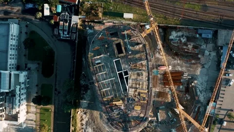 Aerial view of construction site with tower cranes working and building new Stock Footage 262241909