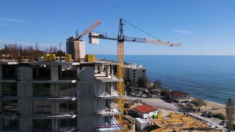 Aerial view of a construction site with tower cranes building modern apartments Video stock 319750041
