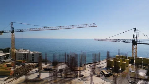 Aerial view of a construction site with tower cranes building modern apartments Stock Footage 319750196