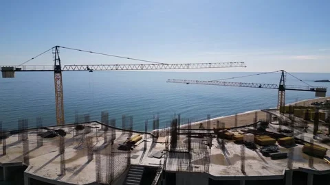 Aerial view of a construction site with tower cranes building modern apartments Stock Footage 319750682