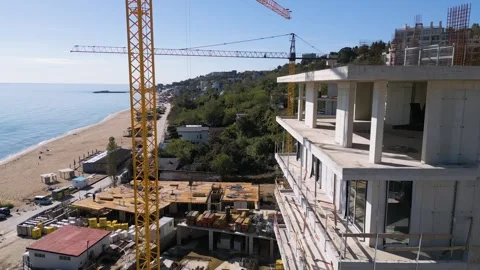 Aerial view of a construction site with tower cranes building modern apartments Stock Footage 319751562