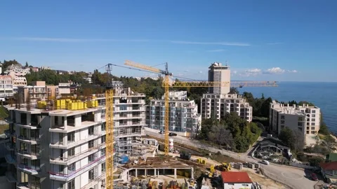 Aerial view of a construction site with tower cranes building modern apartments Stock Footage 319752084