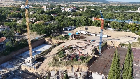 Aerial View of Construction Site with Tower Cranes and Foundation Work Stock Footage 341481985