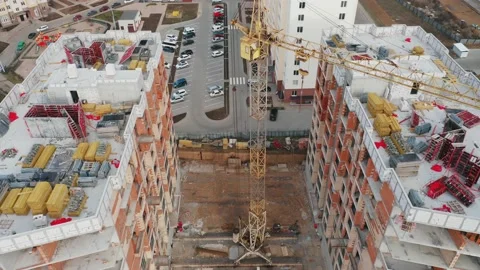 Aerial view of the construction site of two residential buildings in a new area. Stock Footage 168880961