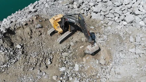Aerial view construction site where excavation machine is working by the coast Video stock 104194656
