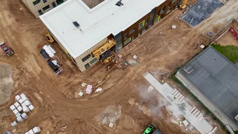 Aerial View of Construction Site with Workers and Machinery Stock Footage 297214389