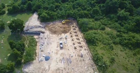 Aerial View of Construction Site with Working Digger Stock Footage 76973757
