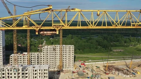 Aerial view of construction site with yellow crane, Russia. Stock Footage 345408293