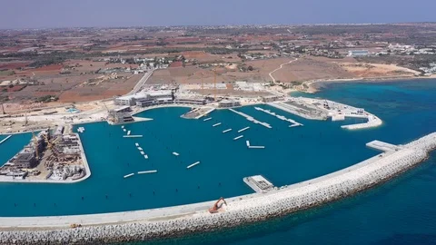 Aerial view of the construction of the stone defense of the marina Stock Footage 120086040