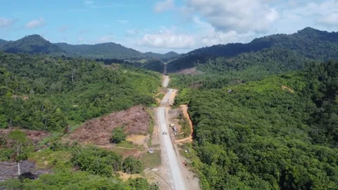 Aerial view of the construction of the toll road from Tanah Bumbu to Banjar.. Stock Footage 248341209