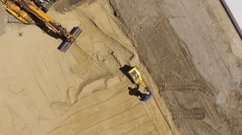 Aerial view of a construction worker on a construction site at work Stock Footage 63974267