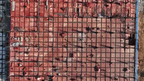 Aerial view of construction workers building a structural framework. Stock Footage 340134411