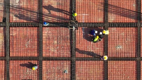 Aerial view of construction workers building a structural framework. Stock Footage 340134420