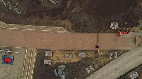 Aerial view of construction workers paving a path in Latvia. Stock Footage 340813962