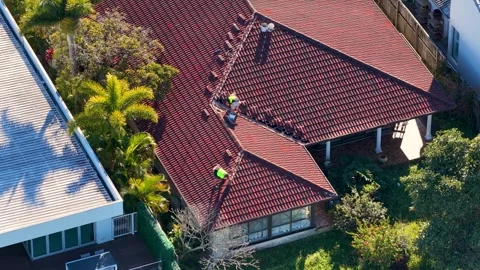 Aerial View of Construction Workers Repairing Terracotta Tile Roof Stock Footage 341837101