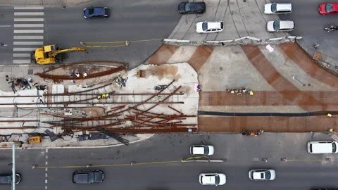 Aerial View of Construction Workers Resting During Break on the Tram Tracks - 4K Stock Footage 247578697