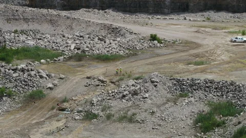 Aerial view of construction workers in rock quarry Stock Footage 142262615